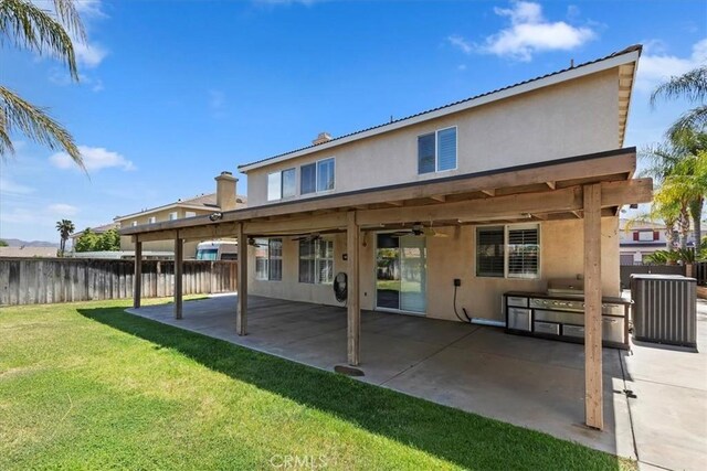 8433 Lindenhurst St, Riverside, CA 92508 - rear view of house with stucco siding, a fenced backyard, and a patio area