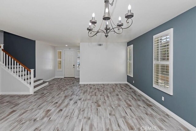 8433 Lindenhurst St, Riverside, CA 92508 - entrance foyer featuring a chandelier, stairs, and wood finished floors