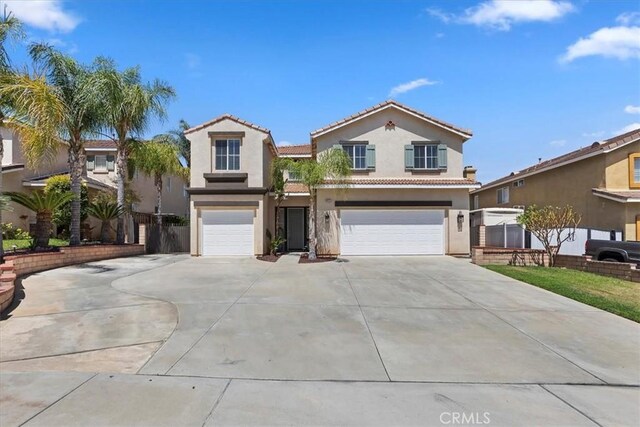 8433 Lindenhurst St, Riverside, CA 92508 - mediterranean / spanish-style house with a garage, concrete driveway, stucco siding, and a tiled roof