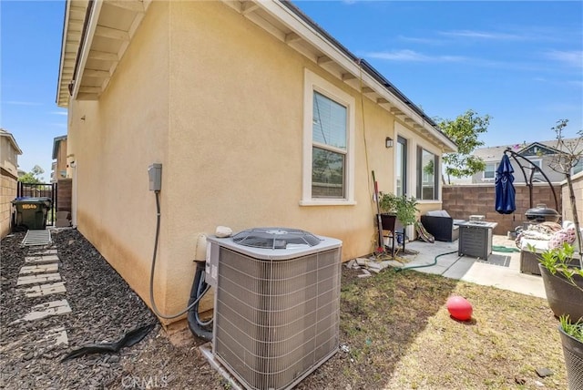 16548 Monteviejo St, Fontana, CA 92336 - view of property exterior with central AC, stucco siding, and a patio