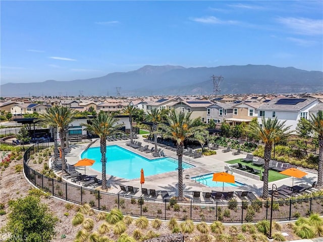 16548 Monteviejo St, Fontana, CA 92336 - community pool with a mountain view, a residential view, and a patio area