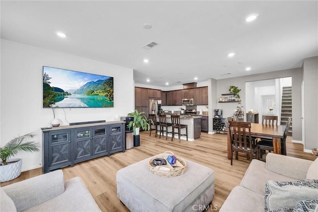 16548 Monteviejo St, Fontana, CA 92336 - living area with recessed lighting, light wood-style floors, and baseboards