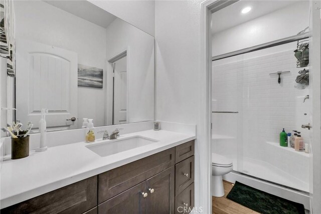 16548 Monteviejo St, Fontana, CA 92336 - bathroom with a shower stall, vanity, and toilet