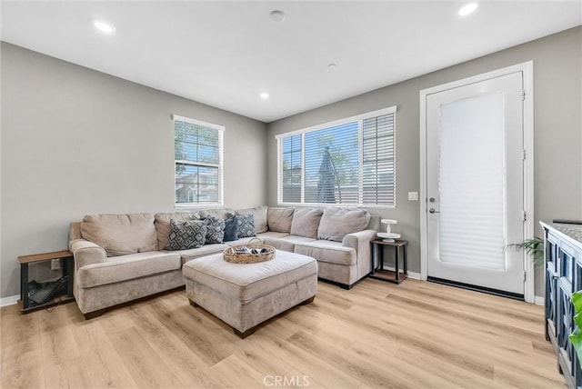 16548 Monteviejo St, Fontana, CA 92336 - living room with light wood-style floors, baseboards, and recessed lighting