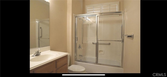 78379 Kistler Way, Palm Desert, CA 92211 - bathroom featuring toilet, vanity, and combined bath / shower with glass door