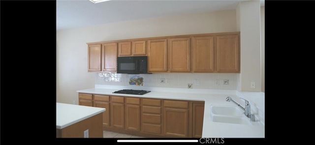 78379 Kistler Way, Palm Desert, CA 92211 - kitchen with black appliances, a sink, light countertops, and tasteful backsplash