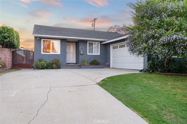 14725 Kornblum Ave, Hawthorne, CA 90250 - view of front of property with concrete driveway, a front yard, an attached garage, stucco siding, and a gate