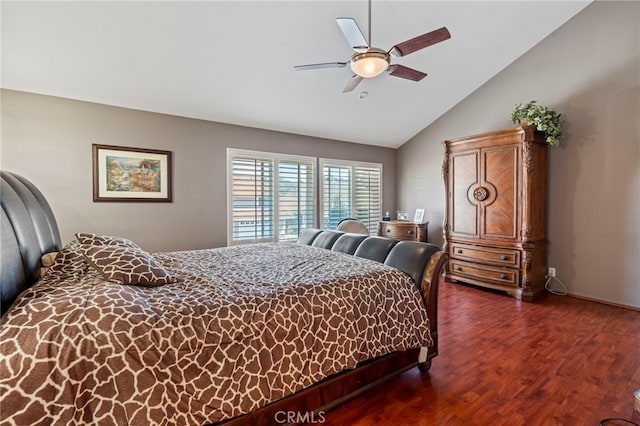 bedroom with dark wood-type flooring, a ceiling fan, and high vaulted ceiling
