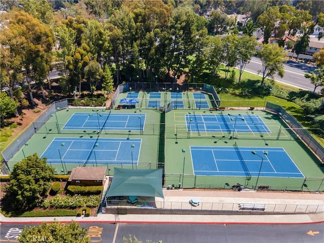 view of tennis court featuring fence