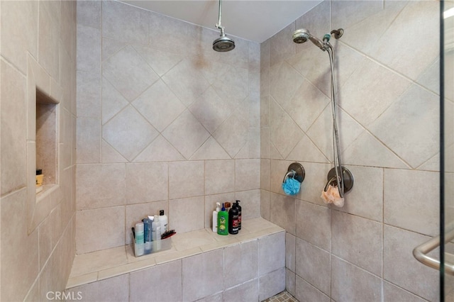 full bath with tiled shower