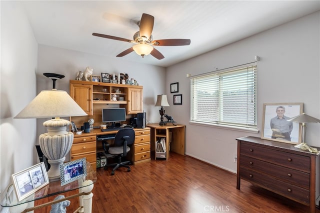 office space featuring dark wood-type flooring, ceiling fan, and baseboards