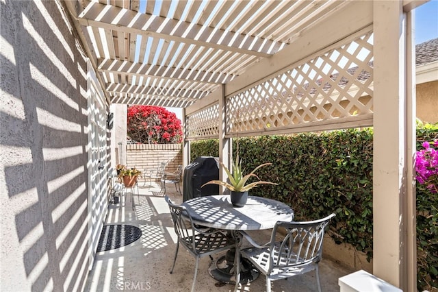 view of patio / terrace with a pergola, outdoor dining space, and grilling area