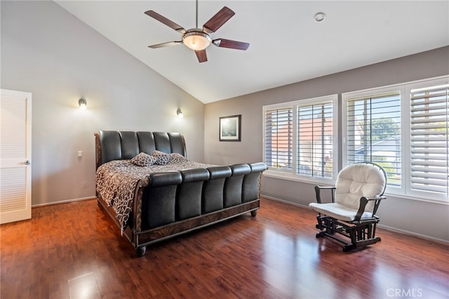 bedroom with wood finished floors, baseboards, ceiling fan, and high vaulted ceiling
