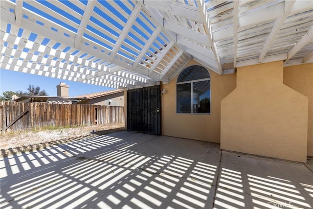 view of patio / terrace with fence and a pergola