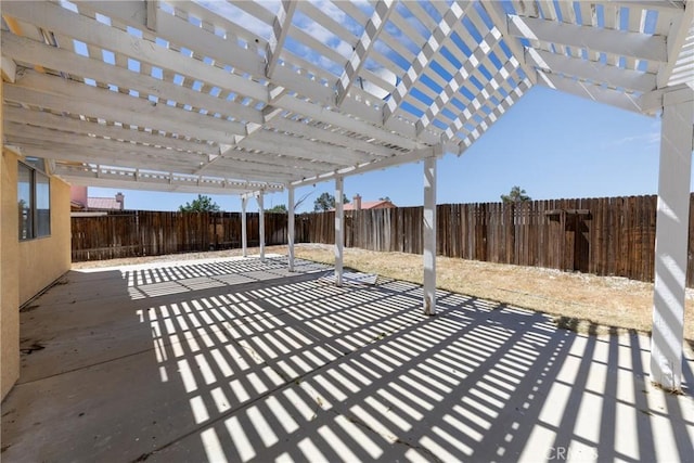 view of patio / terrace with a fenced backyard and a pergola