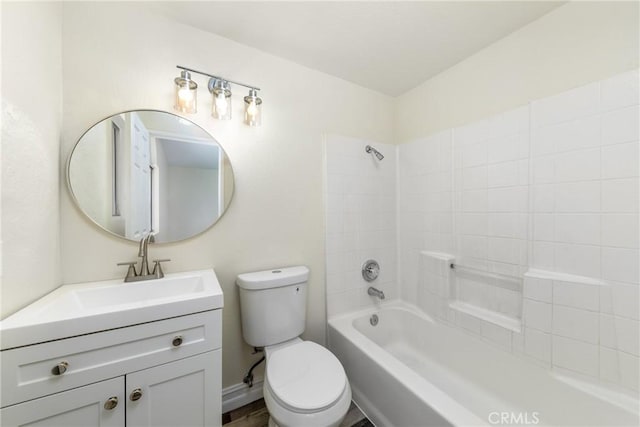 full bath with toilet, vanity, and washtub / shower combination