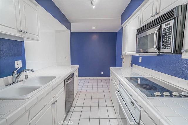 5050 Coldwater Canyon Ave Unit 306, Sherman Oaks, CA 91423 - kitchen featuring tile counters, black electric cooktop, a sink, and white oven