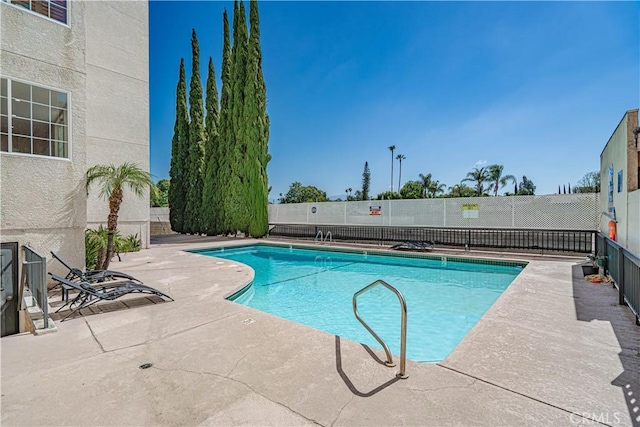 5050 Coldwater Canyon Ave Unit 306, Sherman Oaks, CA 91423 - community pool featuring a patio and fence