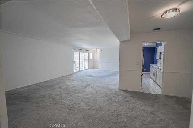 5050 Coldwater Canyon Ave Unit 306, Sherman Oaks, CA 91423 - spare room featuring carpet floors, baseboards, and a textured ceiling