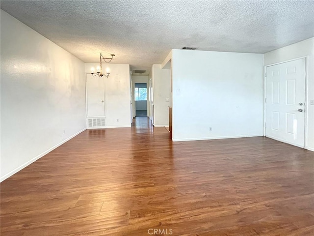 3078 Knollwood Ave, La Verne, CA 91750 - spare room with a chandelier, wood finished floors, a textured ceiling, and baseboards