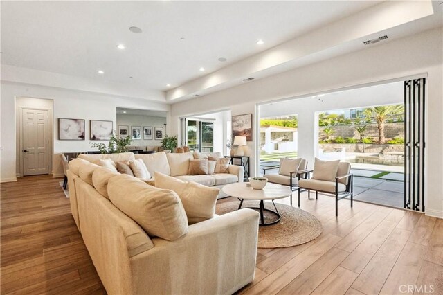 17550 Bretton Woods Pl, Riverside, CA 92504 - living area featuring wood finished floors, recessed lighting, and baseboards