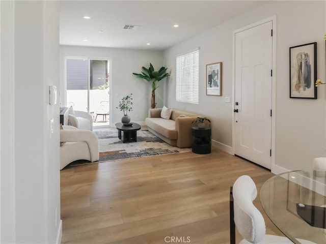 613 E Walnut Ave, Monrovia, CA 91016 - living area with wood finished floors, healthy amount of natural light, recessed lighting, and baseboards