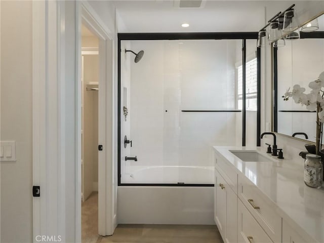 613 E Walnut Ave, Monrovia, CA 91016 - bathroom with vanity, combined bath / shower with glass door, and wood finished floors