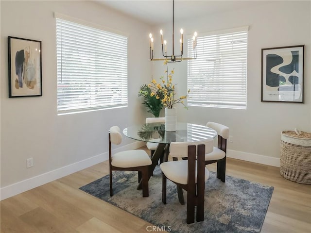 613 E Walnut Ave, Monrovia, CA 91016 - dining space with a chandelier, baseboards, and wood finished floors