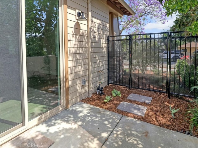 613 E Walnut Ave, Monrovia, CA 91016 - view of property exterior with a gate and a patio