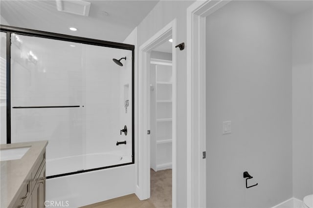 613 E Walnut Ave, Monrovia, CA 91016 - bathroom featuring bath / shower combo with glass door, vanity, a spacious closet, and recessed lighting