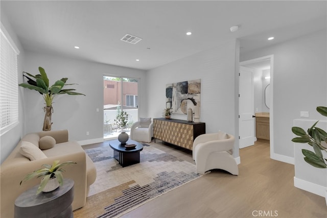 613 E Walnut Ave, Monrovia, CA 91016 - living area featuring light wood-style flooring and recessed lighting