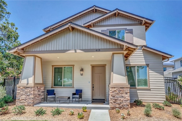 613 E Walnut Ave, Monrovia, CA 91016 - craftsman-style house featuring a porch and stone siding