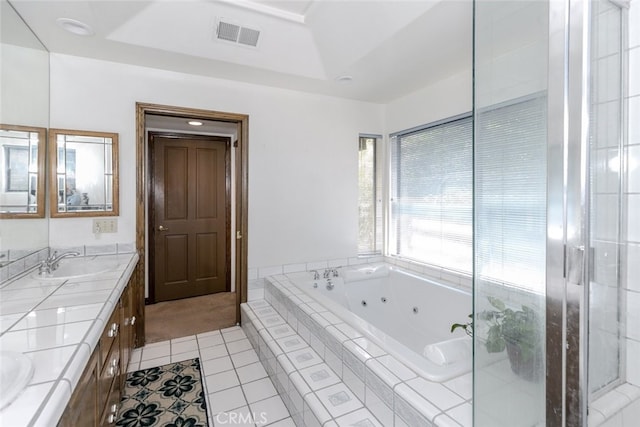24300 Sylvan Glen Rd, Calabasas, CA 91302 - full bath with tile patterned flooring, a tub with jets, double vanity, and a stall shower