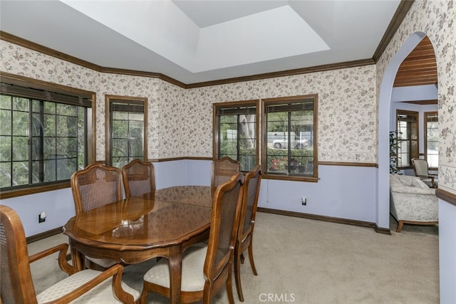 24300 Sylvan Glen Rd, Calabasas, CA 91302 - dining space featuring plenty of natural light, wallpapered walls, light colored carpet, ornamental molding, and arched walkways