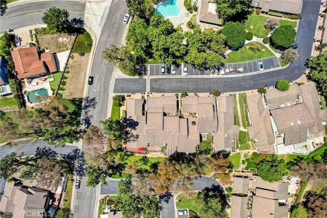 6587 E Via Fresco, Anaheim Hills, CA 92807 - aerial overview of property's location featuring a pool area and nearby suburban area