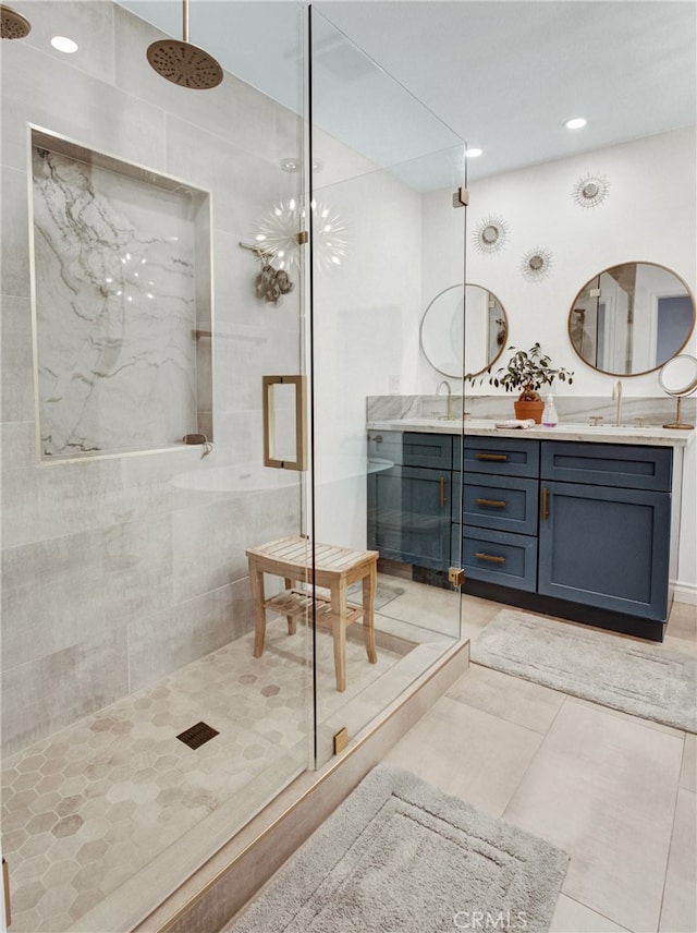 6587 E Via Fresco, Anaheim Hills, CA 92807 - bathroom featuring a marble finish shower, double vanity, tile patterned floors, and recessed lighting