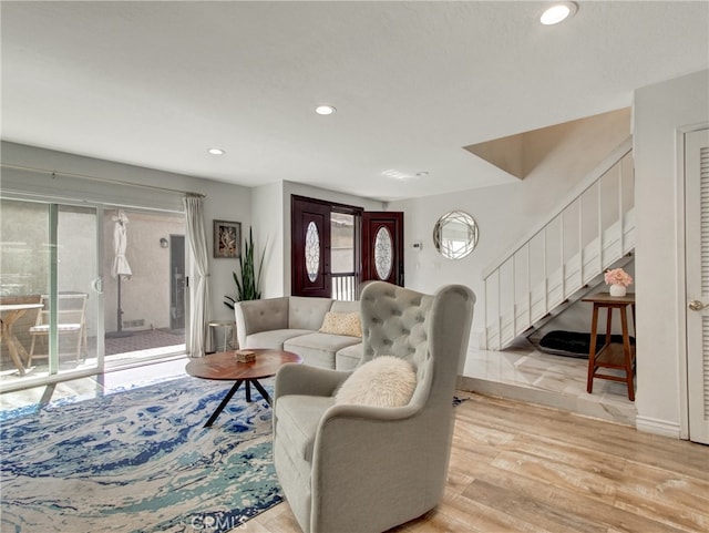 6587 E Via Fresco, Anaheim Hills, CA 92807 - living room featuring stairs, light wood-style flooring, and recessed lighting