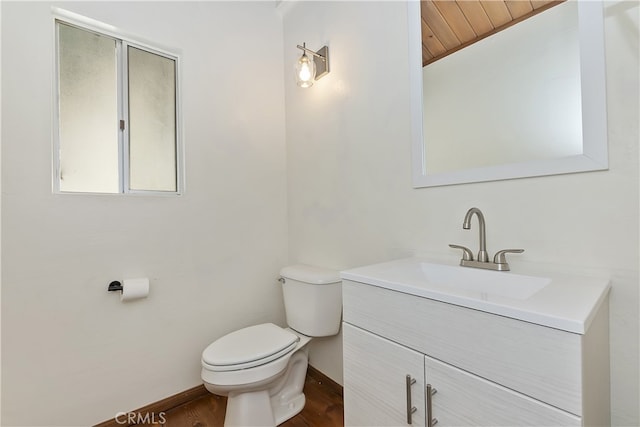 859 Poe Ct, Lake Arrowhead, CA 92352 - bathroom featuring toilet, vanity, lofted ceiling, baseboards, and wood finished floors