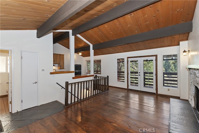 859 Poe Ct, Lake Arrowhead, CA 92352 - empty room with french doors, wood-type flooring, a stone fireplace, and baseboards