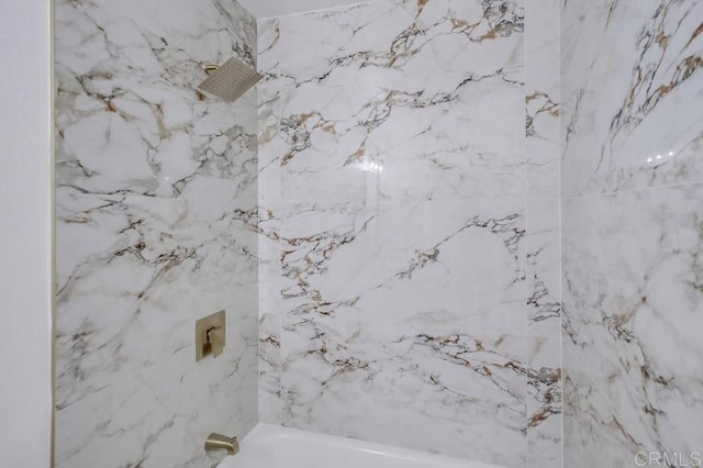 bathroom featuring washtub / shower combination