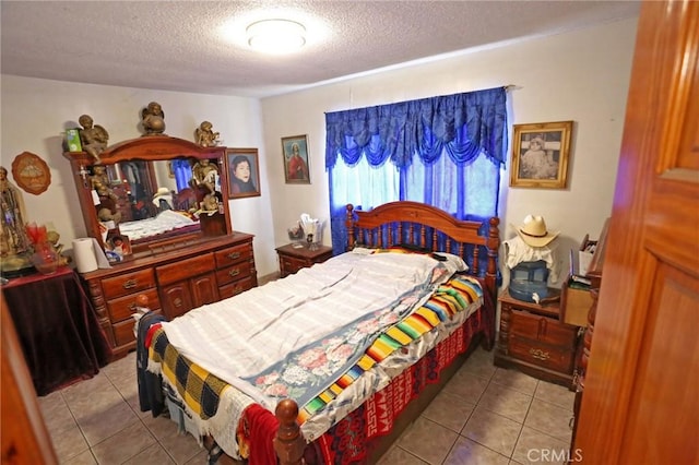 12873 Salisbury St, Baldwin Park, CA 91706 - bedroom featuring a textured ceiling and tile patterned flooring
