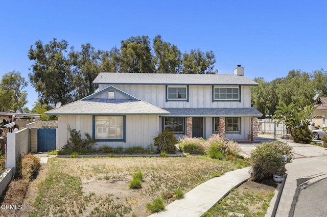 2575 Gayle Pl, Simi Valley, CA 93065 - traditional-style house featuring a chimney, roof with shingles, and a gate