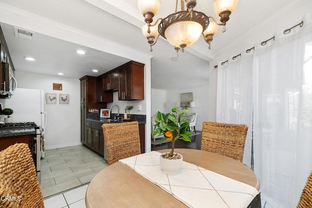 dining area featuring recessed lighting, ornamental molding, light tile patterned floors, and baseboards