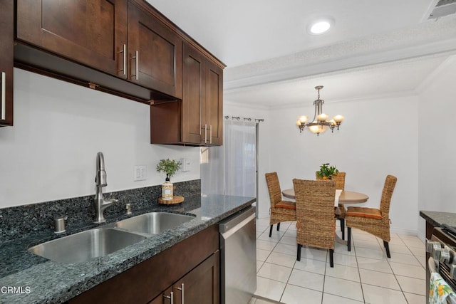kitchen with appliances with stainless steel finishes, a sink, crown molding, a chandelier, and light tile patterned floors