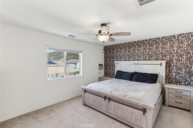 29586 Bisbee Ct, Winchester, CA 92596 - bedroom with light carpet, baseboards, wallpapered walls, and ceiling fan
