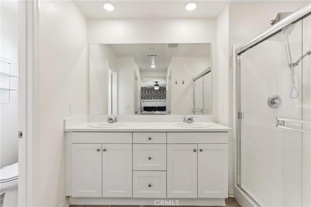 29586 Bisbee Ct, Winchester, CA 92596 - bathroom featuring a shower stall, double vanity, toilet, and ensuite bathroom