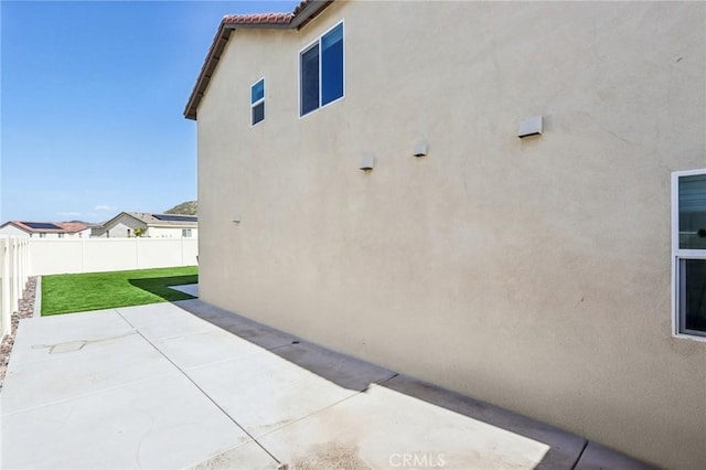 29586 Bisbee Ct, Winchester, CA 92596 - view of property exterior featuring stucco siding and a patio area
