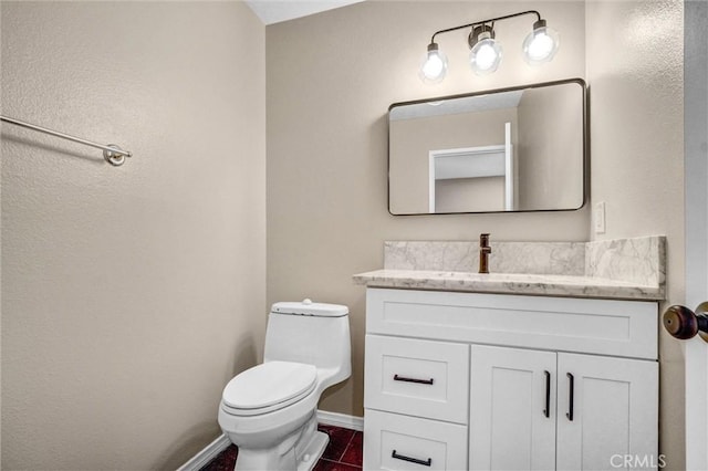 401 Deerfield Ave Unit 84, Irvine, CA 92606 - bathroom with toilet, vanity, baseboards, and tile patterned flooring