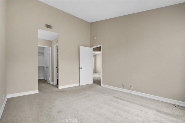 401 Deerfield Ave Unit 84, Irvine, CA 92606 - unfurnished bedroom with carpet floors, a walk in closet, baseboards, and a closet
