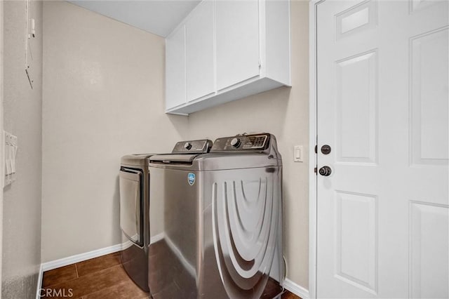 401 Deerfield Ave Unit 84, Irvine, CA 92606 - laundry room with cabinet space, washer and clothes dryer, baseboards, and dark tile patterned floors